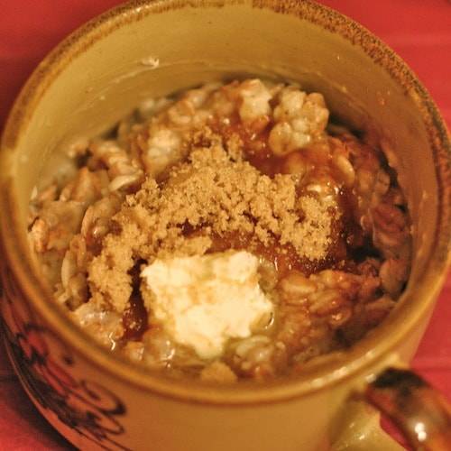 Morning grains topped with brown sugar in a mug.