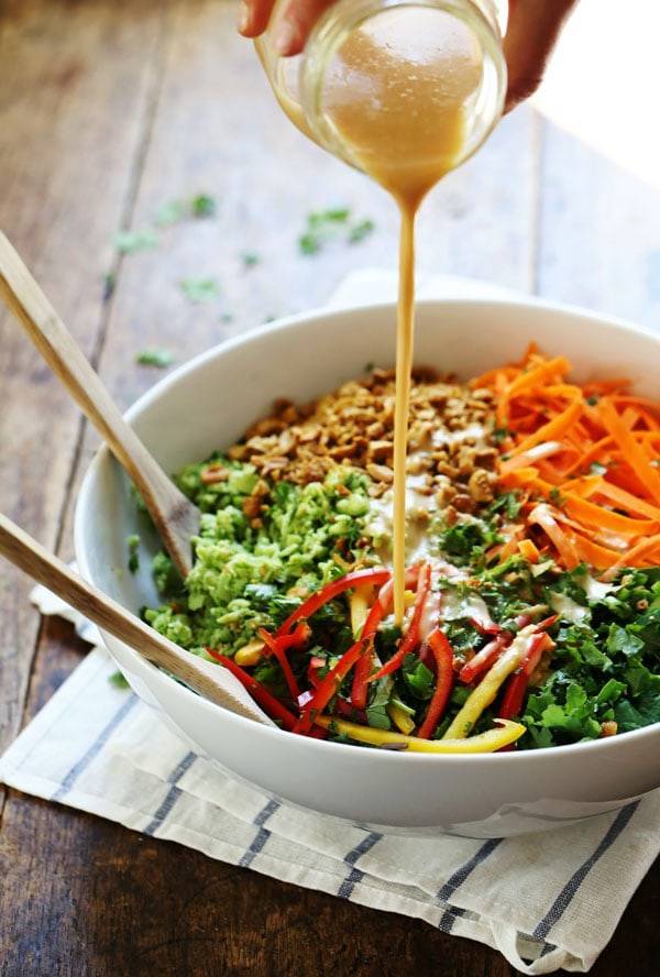 Chopped Thai Salad with Sesame Garlic Dressing drizzle in a white bowl.