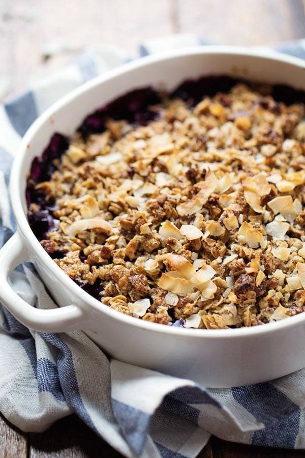 Simple Oat and Blueberry Crisp in a white baking dish.