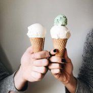 Lindsay and Bjork holding ice cream cones.