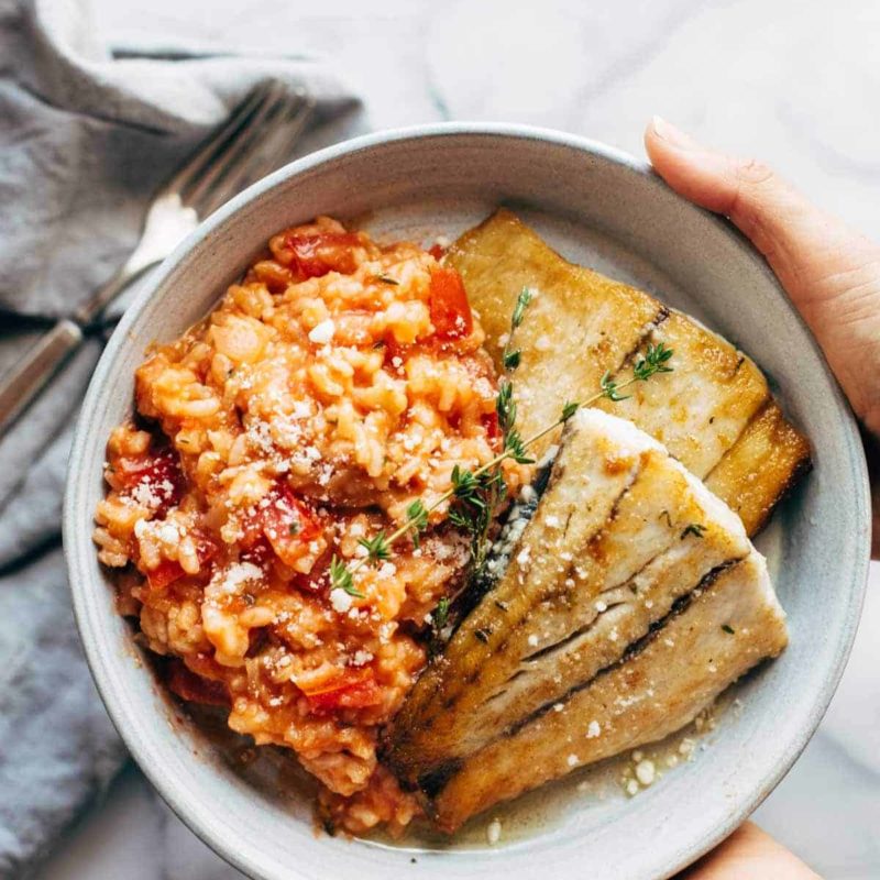 A picture of Creamy Tomato Risotto with Pan Fried Barramundi