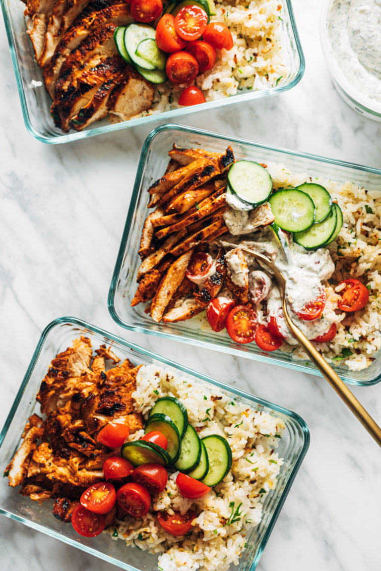 Buffalo chicken bowls in meal prep containers.