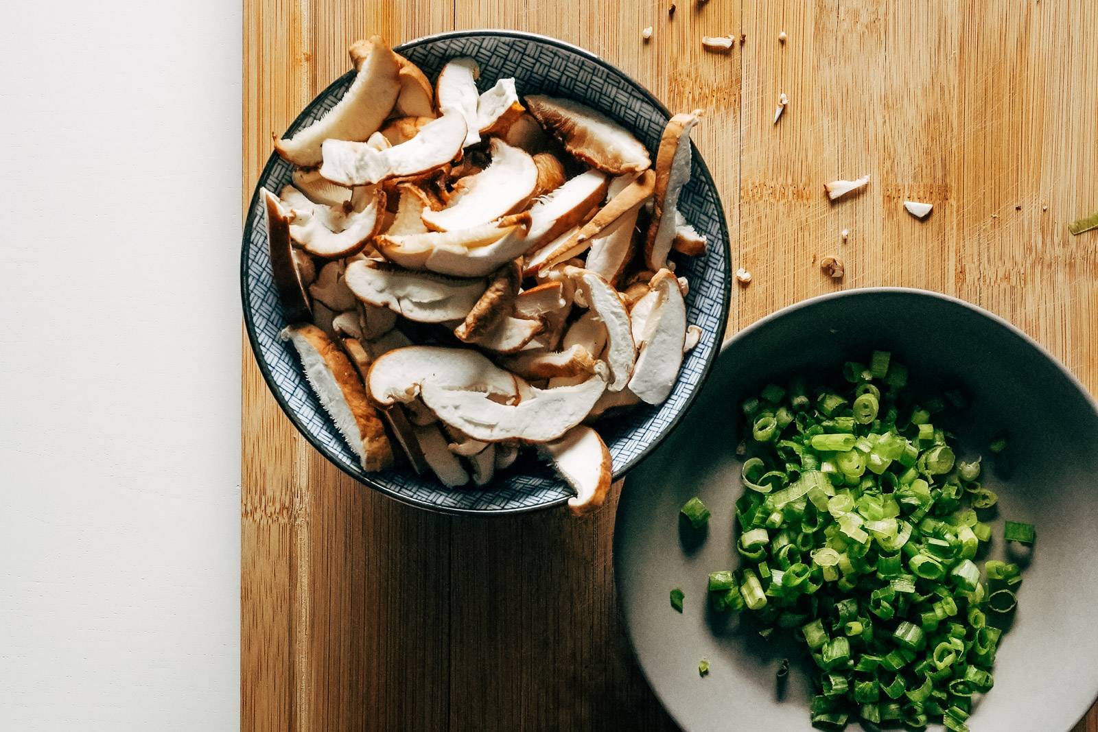 Bowl of shitake mushrooms and green onions