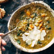 Detox Lentil Soup in a bowl with a spoon.