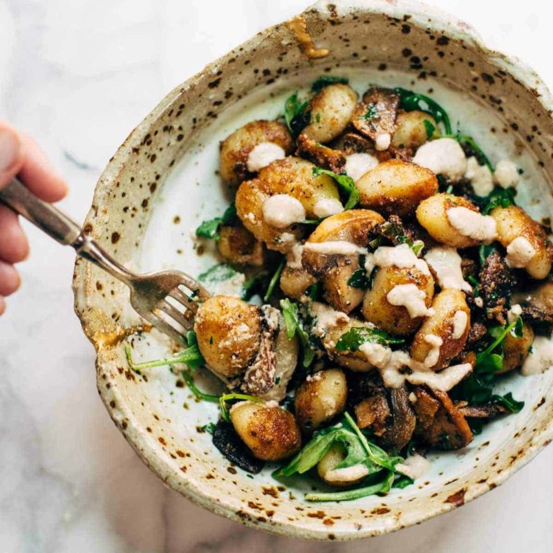 A picture of Mushroom Gnocchi with Arugula and Walnut Pesto