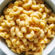 Mac and cheese piled high in a bowl.