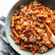 Red Pepper Cashew Pasta in bowl with spoon.