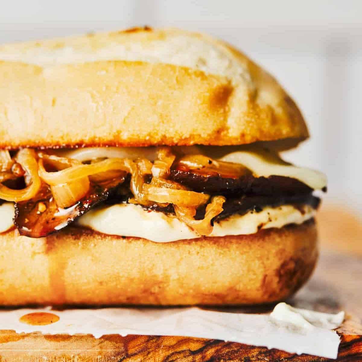 Portobello mushroom sandwhich with carmelized onion on crusty bread.