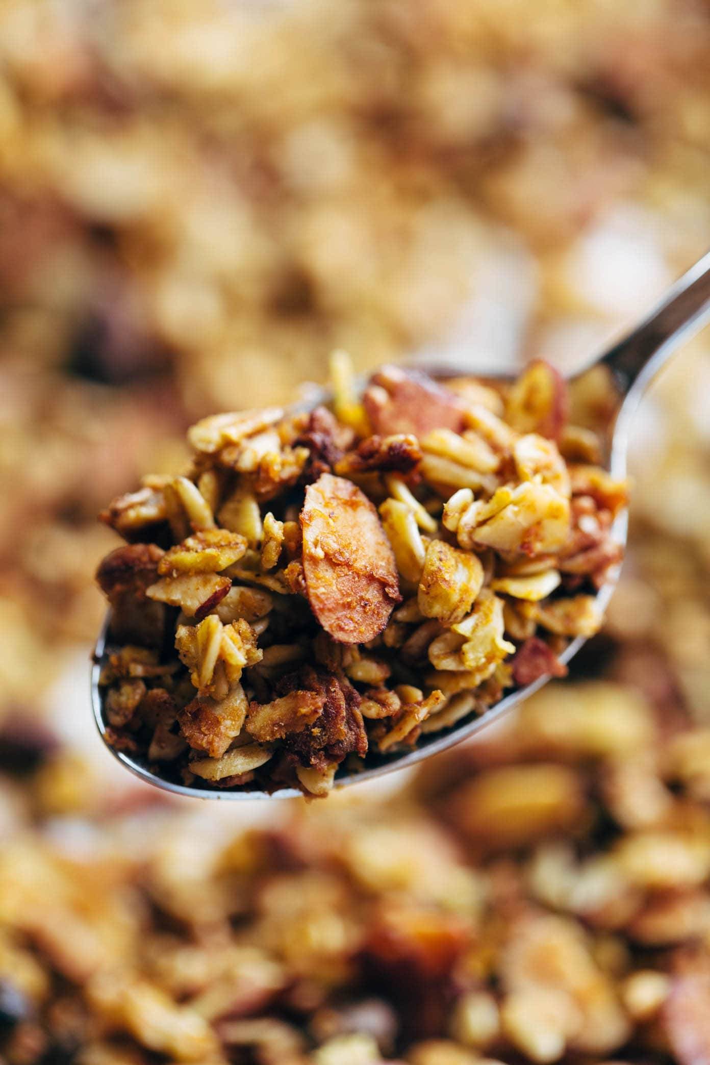 Pumpkin granola on a spoon.