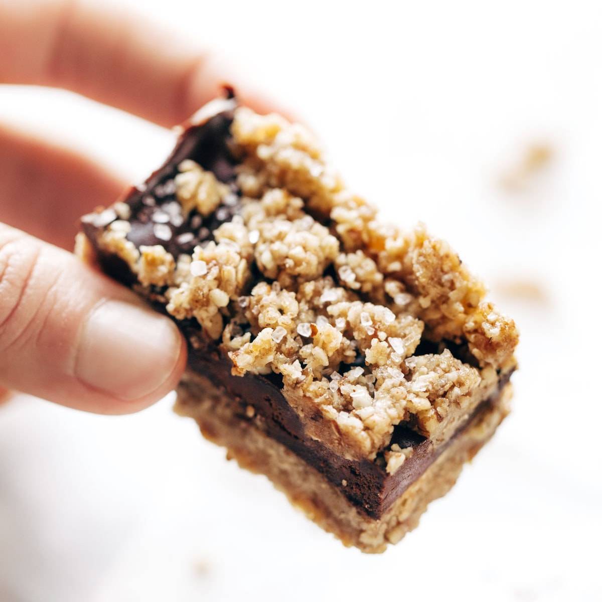 Salted Chocolate Snack Bar held by hand.