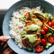 A picture of Salmon with Basil Sauce and Tomato Salad