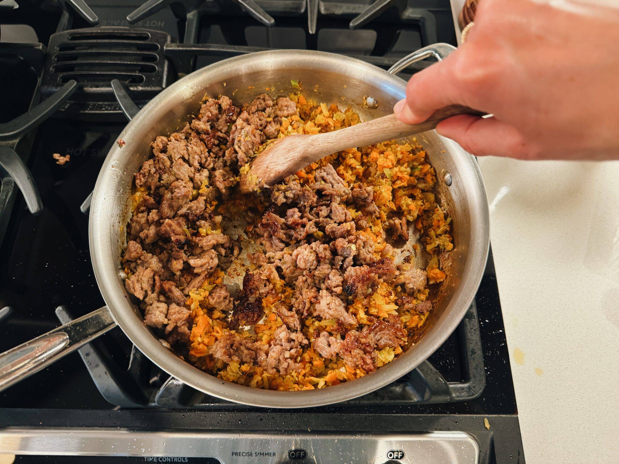 Sausage and veggies going together in the pan