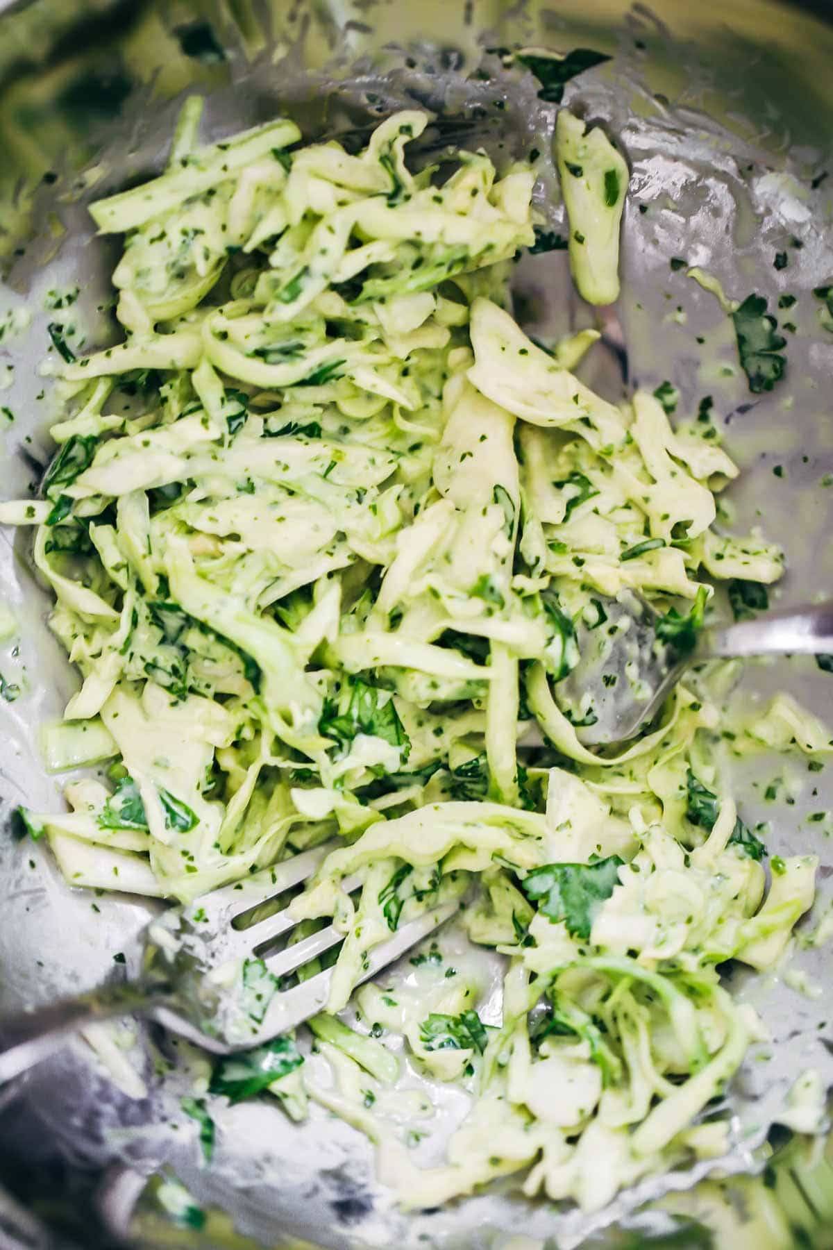 slaw for fish taco bowls and a fork