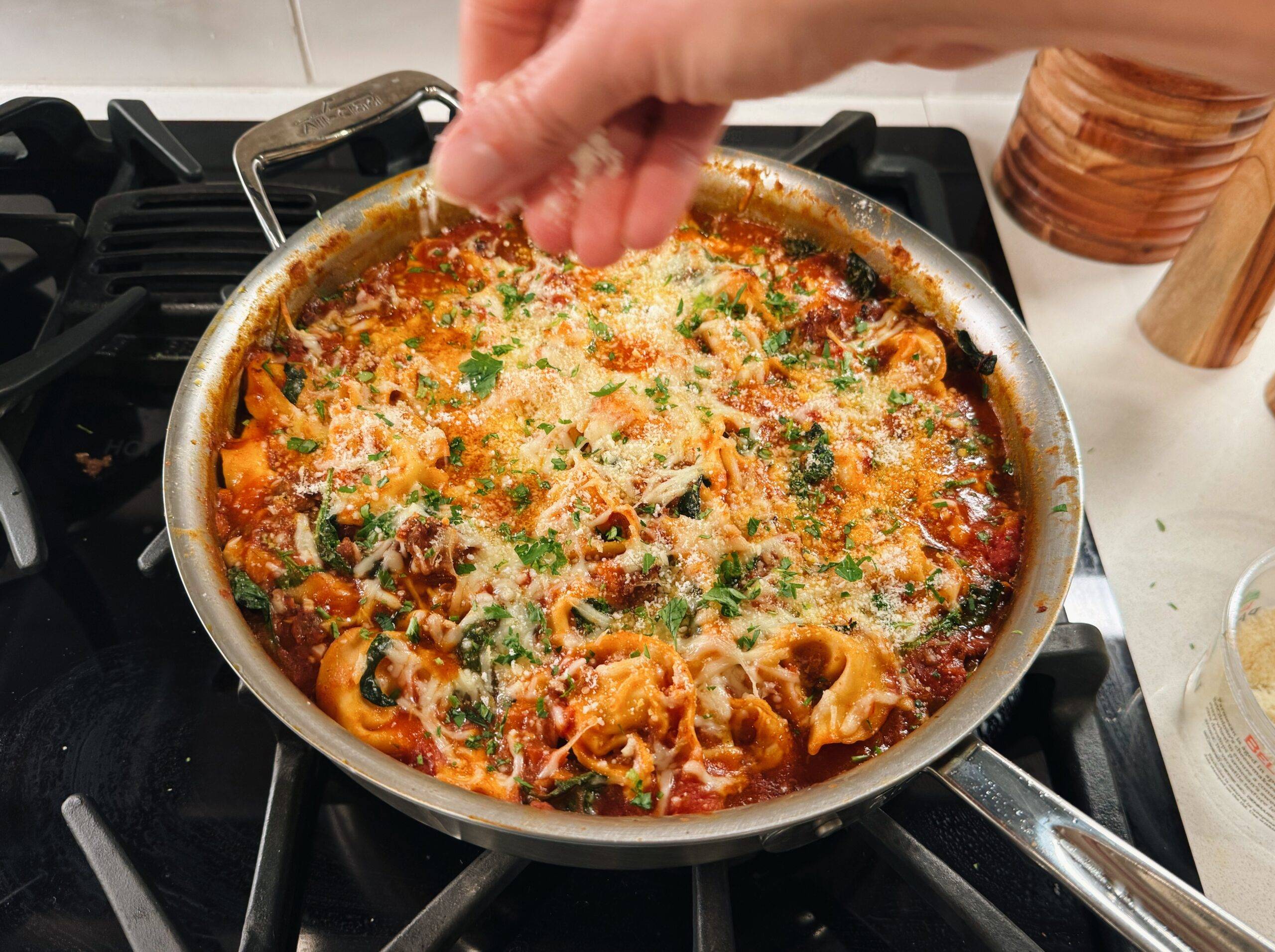 Baking the tortellini with cheese