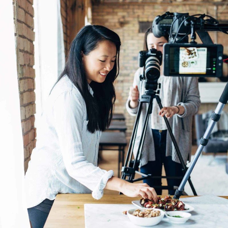 Krista plating food for a video shoot.