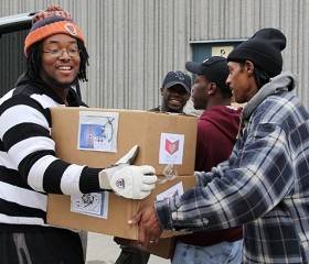 Men carrying boxes.