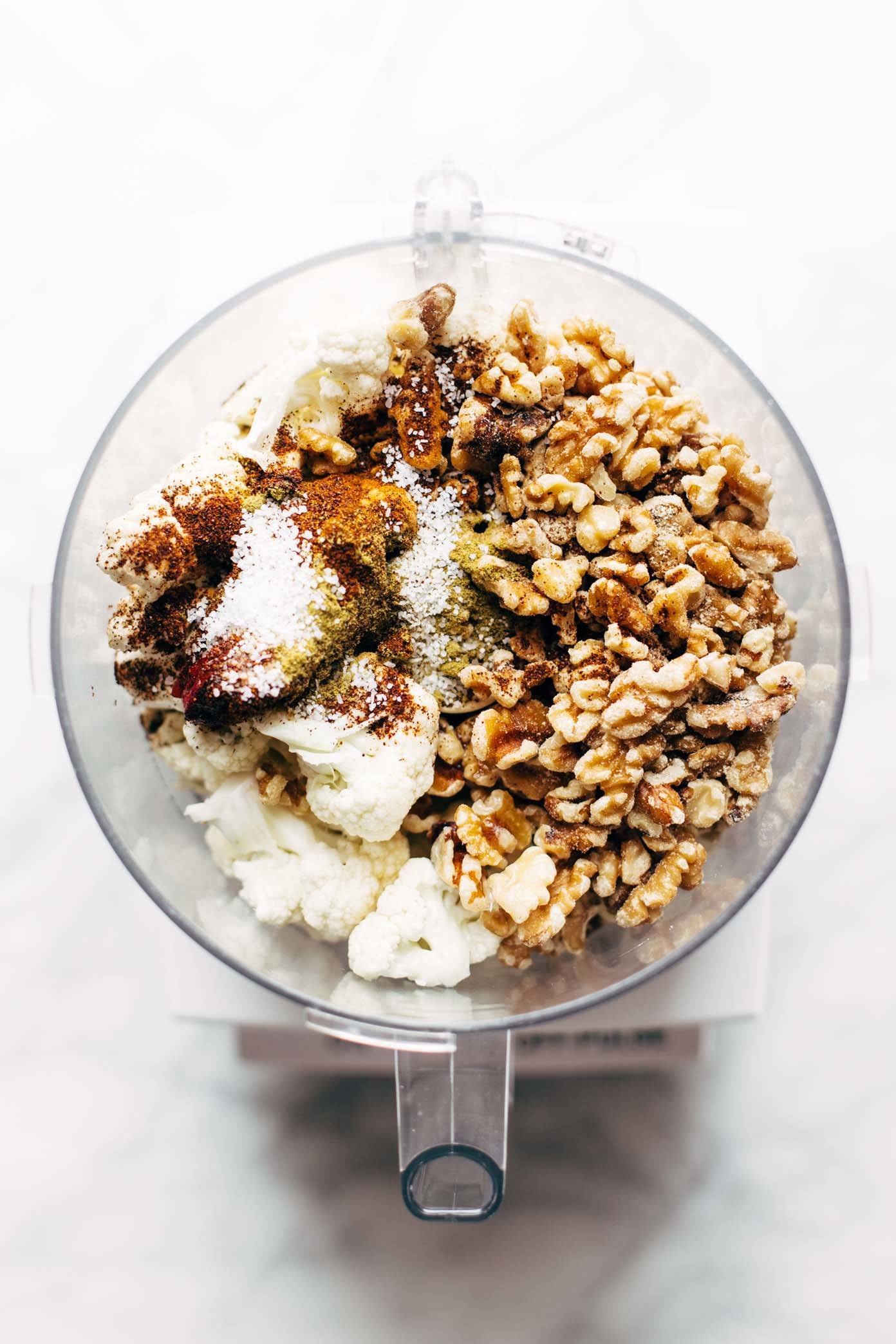 Cauliflower and walnut with spices in a bowl prepped for taco dish.