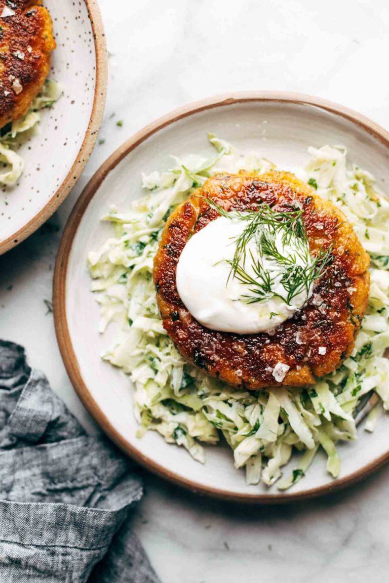 Salmon Burger on a plate with slaw.